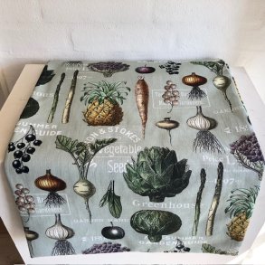 Dug i bomuld i lys grn bund og motiver af farvestrlende grntsager.