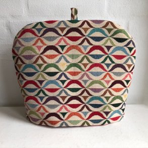 Tehtte i gobelin med retro motiv af blger i mange farver.