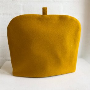 Tehtte i karrygul uld bde udvendig og indvendig.