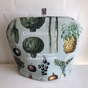 Tehtte i bomuldsstof med motiver af grntsager.